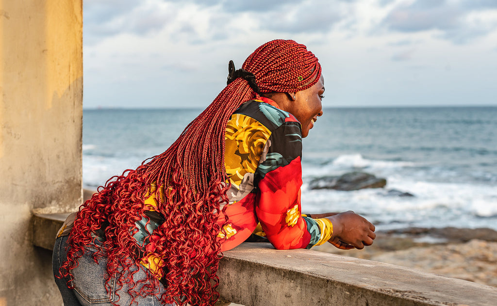 [Ghana] April 18 and 21 declared public holidays - woman enjoys coastal views Acra Ghana, Easter public holidays Ghana