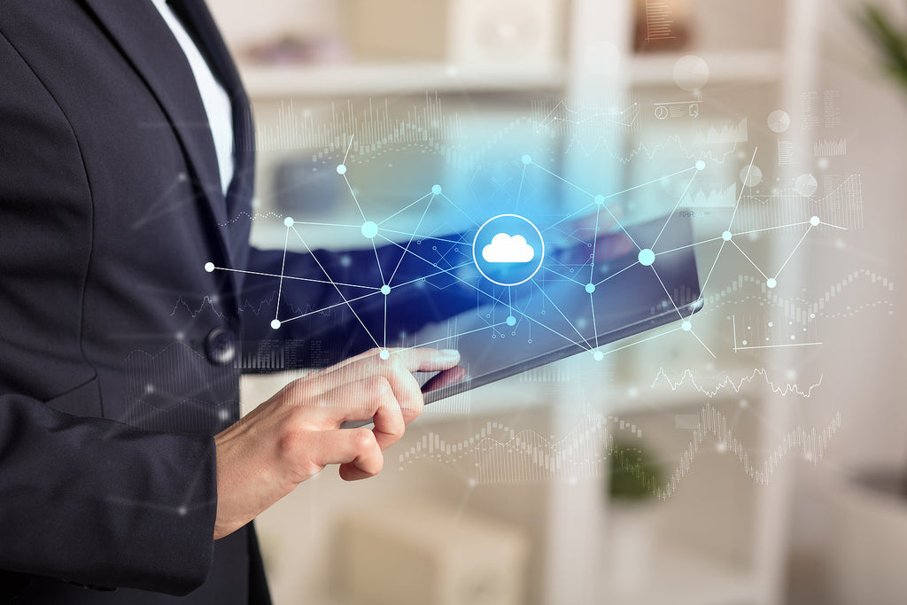 [Global] Acrisure completes acquisition of Heartland Payroll Solutions - payroll manager looking at payment softward on tablet, Acrisure acquires Heartland Payroll