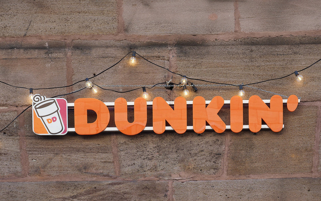[US] Massachusetts fast food franchisees fined for alleged child labour law violations - Dunkin' logo and lights, Dunkin' McDonald's and Subway franchise owners fined for violating child labour law