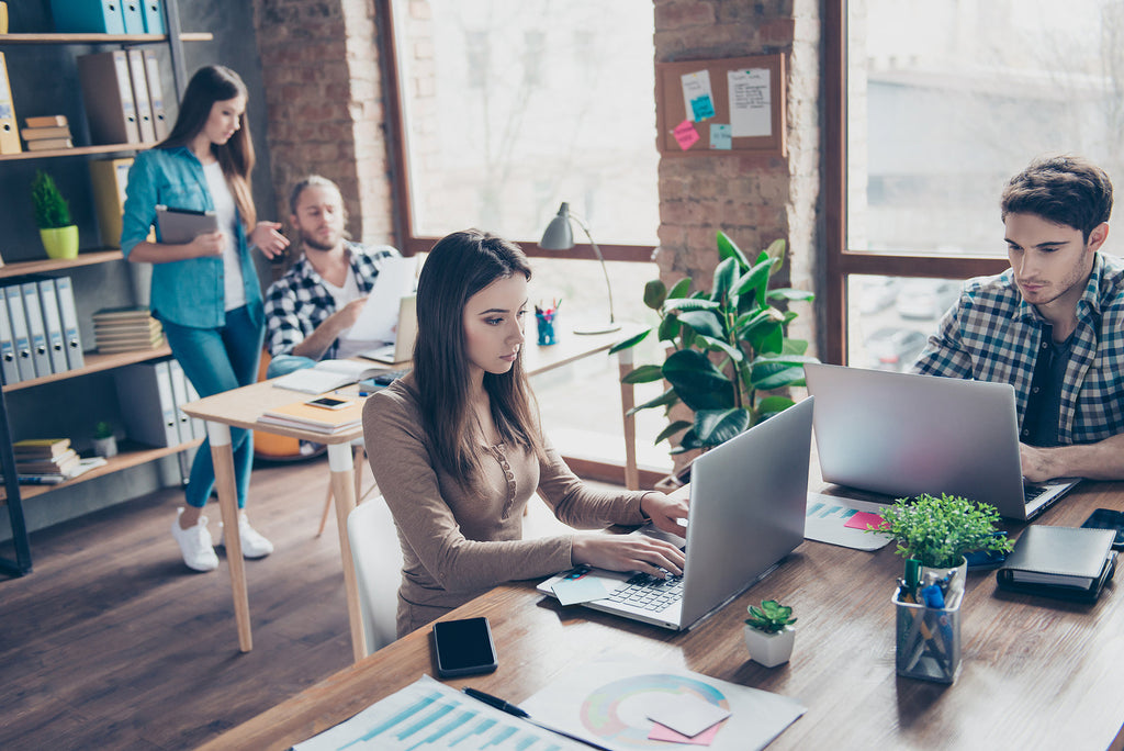 [Global] Workday announces expansion of Workday GO - workers in bright modern office, Workday GO launches to support midsize organisations