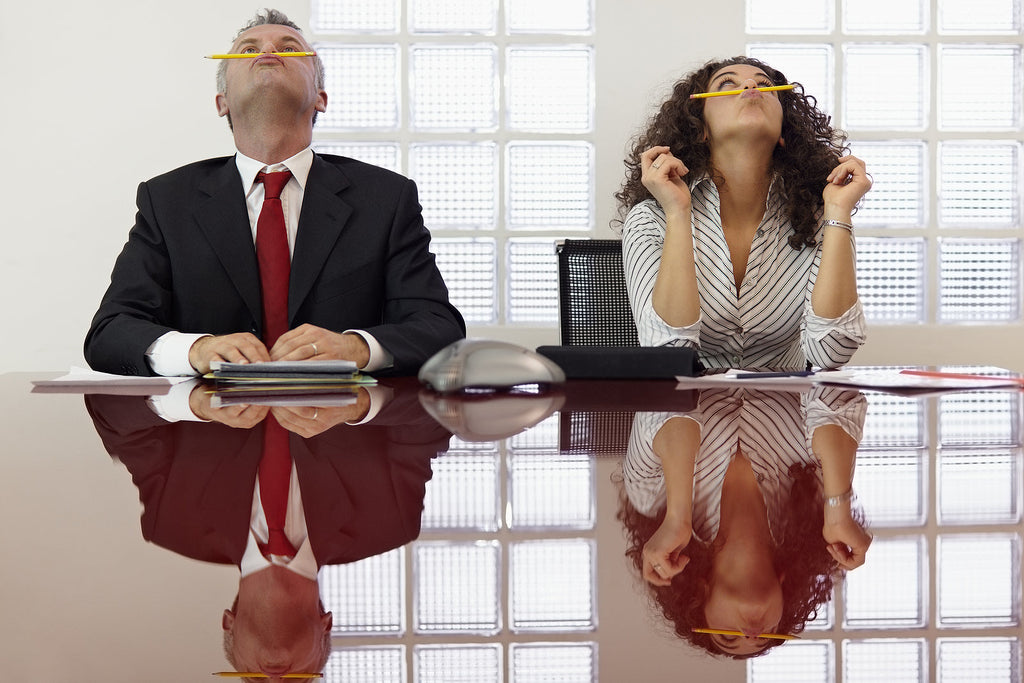 [Australia] Worker engagement falls to just 16% - disengaged employees balancing pencils in meeting, employee engagement dropping Australia