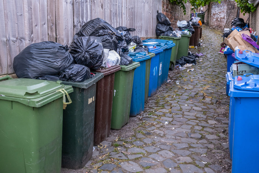 [UK] Birmingham bin strikes will continue after workers reject offer - overflowing wheelie bins in alleyway, Birmingham bin workers reject pay offer