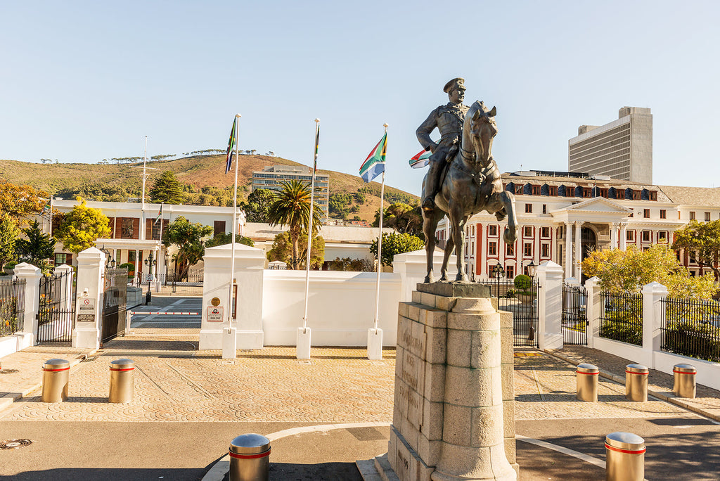 [South Africa] Finance minister forced to delay budget after tax row - South African parliament exterior, South African Budget delayed