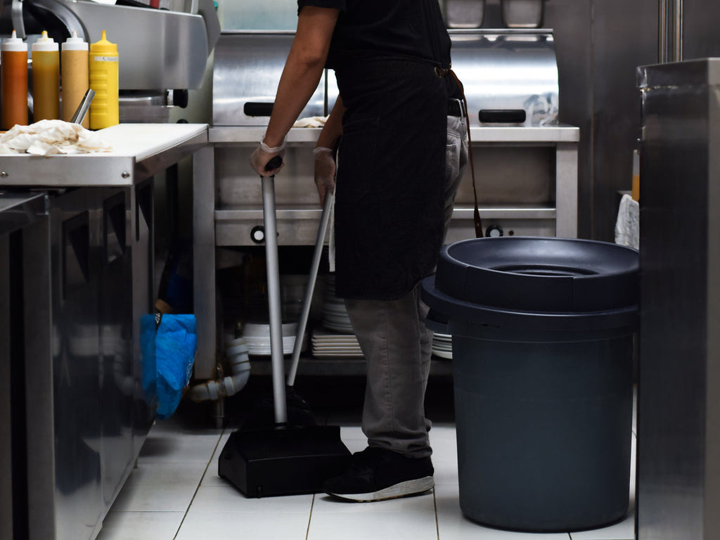 [Canada] Ontario’s hourly minimum wage rises - kitchen porter cleaning floor